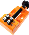 Legit Tight Grip Mini Table Vise With Quick Release ABS Plastic Jaws Compact Drill Press Clamping Bench For Tiny Parts Electronics Jewelry Craft And Precision Model Projects in orange, top view.