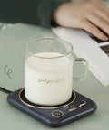Smart Home Cup Warmer Heating Plate With Smart Temp Control Keeps Your Daily Sips Locked And Toasty Auto Shutoff Safety Feature 25 Watt Energy Savers Green Coaster Drink Heater For Coffee And Milk Tea with steaming glass of milk.