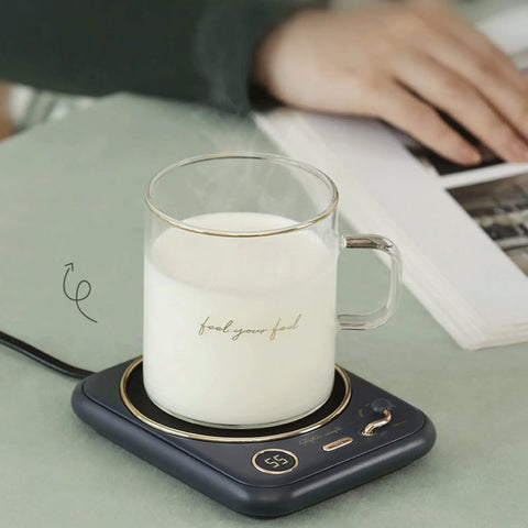 Smart Home Cup Warmer Heating Plate With Smart Temp Control Keeps Your Daily Sips Locked And Toasty Auto Shutoff Safety Feature 25 Watt Energy Savers Green Coaster Drink Heater For Coffee And Milk Tea with steaming glass of milk.