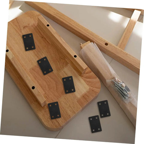 Heavy Duty Stainless Steel Corner Braces on a wood surface with screws, ideal for cabinets and shelves reinforcement.