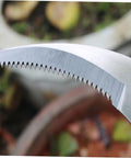 Close-up of serrated edge on Stainless Steel Weeding Sickle Set, Durable Pro Grade All Purpose Backyard Garden Tool for Grass Cutting.