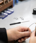 Person using Eyeglass Repair Kit With 527 Replacement Screws And Nose Pads Gotta Have Precision Screwdriver Set for repairs