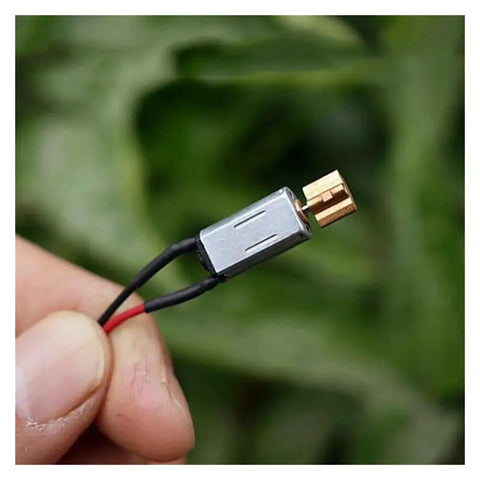 3V Mini Vibration Motor Ultra Compact 8mm By 14.5mm With Copper Eccentric Vibrator held in hand
