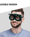 Four Pack Welding Safety Goggles With Flip Up Design showing a man wearing flexible design goggles for heavy duty eye protection.