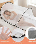 Large Pop Up Mosquito Tent For Adults on bed, shows white mesh and double zipper design, packs down to 13-inch disc.