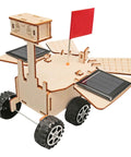 Solar Powered Mars Rover Kit made of wood for DIY engineers, displaying solar panels and wheels, educational STEM project.