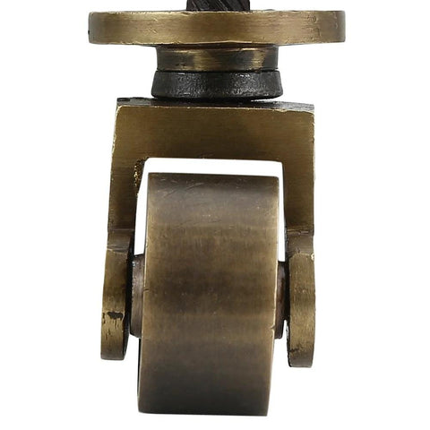 Close-up of heavy duty brass stem caster with antique brass finish, visible threaded stem, 1 inch wheel diameter, floor safe.