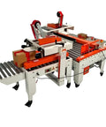 Top Tier Automatic Electric Box Sealer Machine For Secondary Packaging Lines With Smart Tape Tension Control And Sensor Detection For Fast Secure Case Sealing with boxes on conveyor.