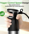 Hand holding the Powerful 1100W Immersion Hand Blender 3 In 1 Corded Stick with trigger speed control in a kitchen.