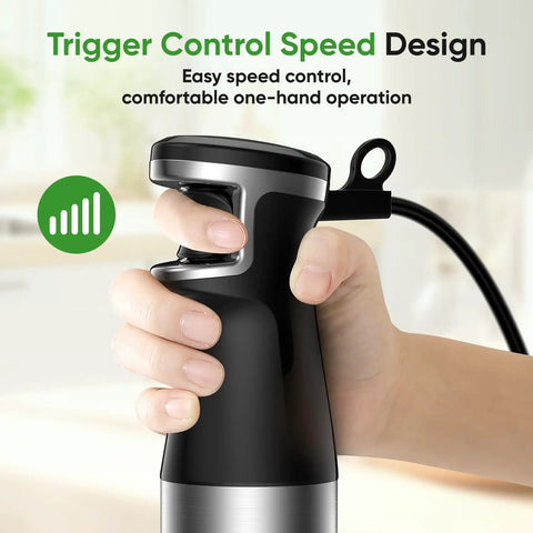 Hand holding the Powerful 1100W Immersion Hand Blender 3 In 1 Corded Stick with trigger speed control in a kitchen.