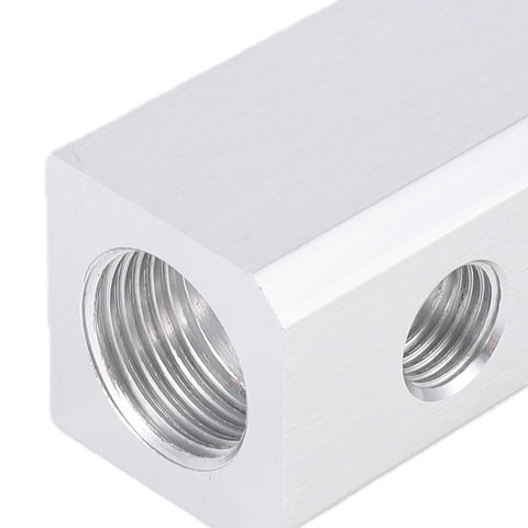Close-up of Beefy Aluminum Pneumatic Air Manifold Block showing 1/2 NPT inlet and 1/4 NPT outlet ports for compressors.