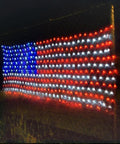 Patriotic LED Flag Net Lights For Outdoor Decor 6.5ft By 3.2ft Waterproof American Flag String Lights glowing at night
