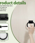 Image of a hand holding one of the Three Pack Black Sliding Barn Door Ring Pulls With Screws Zinc Alloy Door Handles For Outdoor Use illustrating its rotation.