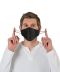 Man wearing 11 Piece Black KF94 Protective Face Masks for Adults with 4 Layer Filter and 3D Design, adjusting ear straps