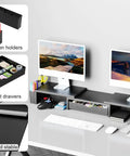 Dual Monitor Stand Riser With Drawer And Pen Holders Desk Organizer And Book Racks For Office Desk Accessories Boss Level Workspace Organizer For Two Monitors In Black, shown installed with two monitors on a desk.