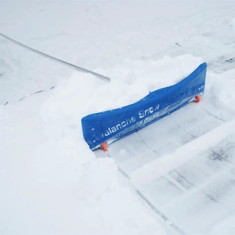 Heavy Duty Extendable Roof Snow Rake With Gliding Rubber Wheels And Lightweight Aluminum Handle Kicks Ice Dam Drama clearing snow from roof.