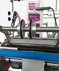Close-up of Semi Automatic Round Bottle Labeling Machine with dual side rollers and easy access foot switch for production.