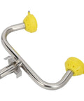 Close-up of Emergency Eyewash Station With Faucet Mount featuring stainless steel nozzle and yellow aerated spray caps.