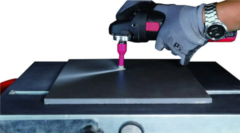 Backdraft Dust Reduction System for Dry Cutting Drilling and Polishing in use on a large sheet, with drill and slot visible.