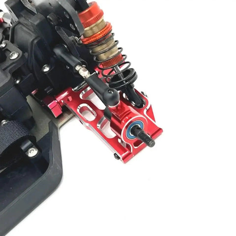 Heavy Duty Metal Front And Rear Suspension Arm Steering Cup Hub Carrier Set For 10th Scale RC Cars Compatible With PTG2 Platform Rad Beefy Upgrade Kit In Bright Red close-up view of installed steering cup and control arm.