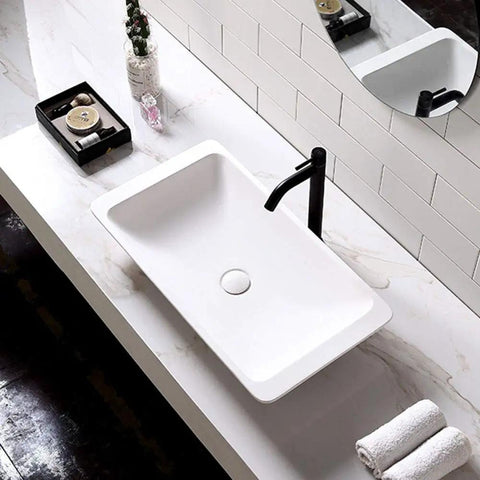 Freestanding Above Counter Rectangle Bathroom Sink Artificial Stone Vanity Basin Scratch Resistant Surface For Zero Drama Cleaning Built Tough For Heavy Daily Use Smooth Operator Design With Crisp Polished Finish on a marble countertop.