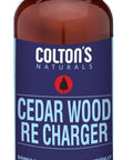 Brown bottle labeled 'Cedar Wood Re Charger' by Colton's Naturals, designed to restore cedar scent in wood.