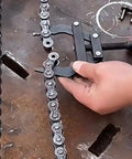 Motorcycle Chain Tensioner Tool With Easy To Use Design And Steel Build For Industrial Maintenance in use on steel chain.