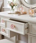 Legit Gorgeous Gold Floral Cabinet Knobs With Sparkling Rhinestone Center 5 Petal Pearlescent Enamel Dresser Pulls on vanity drawer.