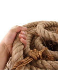Hand holding 100 Percent Natural Hemp Rope Thick 1 Inch By 100 Ft for heavy duty outdoor use, showing braided texture and strength.