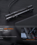 PD36R Pro Dual Battery Bundle 2800 Lumen USB C Rechargeable Tactical Flashlight on black surface near USB-C power bank