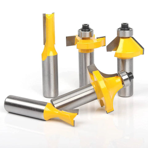 Close-up of four carbide-tipped bits from the Professional Router Bit Set With Thirty Five Pieces And One Half Inch Shank