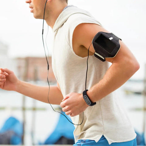 Man jogging wearing Anti Static Wrist Strap With Red Light Indicator For ESD Protection and static electricity removal