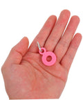 Pink silicone charm from Six Piece Set Straw Charms For Tumblers And Cups Cute Dangle Toppers That Are Easy To Attach Perfect Handle Decor For Parties And Family Events Colorful Water Cup Charms For Party Favors, displayed in hand.