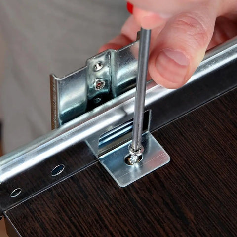Installing Top Notch Keyboard Slide Out Tray Rails With Drawer Track Guides 27Mm White on a desk with a screwdriver.