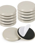 2 Inch Stick On Furniture Sliders 12 Pack Glides For Easy Moving On Carpet And Hardwood Floors Beige shown in stacks with adhesive side visible