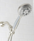 Rio Handheld Shower Head With 5 Sprays And 2.5 GPM Flow In Brushed Nickel, Modern Detachable Design shown mounted on shower arm