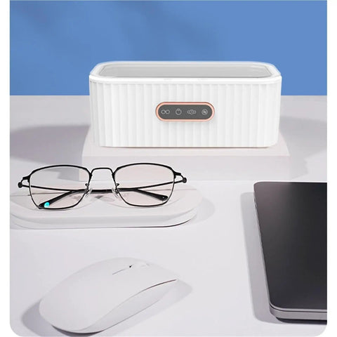 15W Ultrasonic Cleaner Machine With 400Ml Tank, Perfect For Jewelry, Glasses, Watches, And Manicure Tools on a desk with glasses.