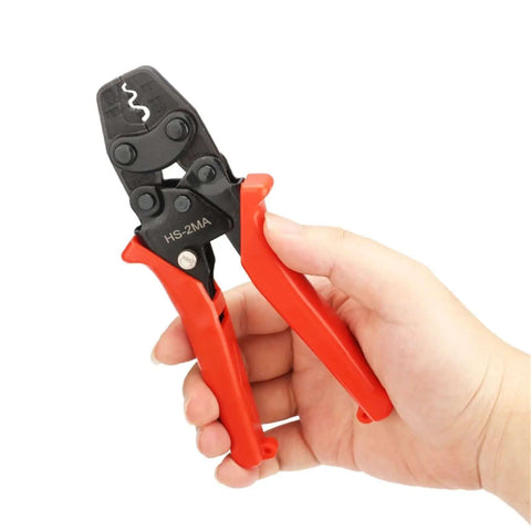 Hand holding Ratchet Crimping Pliers For 0.3-5.5mm Insulated And Bare Terminals, heavy duty high carbon steel, ergonomic handle.