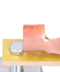 Heavy Duty Magnetic Welding Support With Strong Copper Tail Clamp Grounding Tool For Mechanical Repair And Metal Fixtures Featuring Easy Grip Screw Design close-up of copper tail clamp on insulation board.