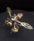 Steampunk 3D Mechanical Bee Model Kit With 158 Pieces, DIY Insect Puzzle For STEM Fans, Teens And Adults, Cool Desk Display Sculpture With Exposed Gears, Layered Wings And Working Details, gold bee model on black background