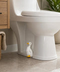 Total Bath Refresh With These Straight Up Cute Ceramic Duck Toilet Bolt Caps Set Of Two Standing Screw Covers Featuring Easy Peasy Setup And Real Deal Rust Protection, shown near toilet.