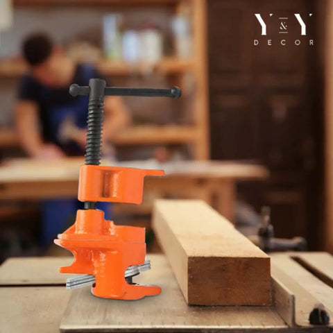 Four Pack Half Inch Pipe Clamps For Woodworking With Beefy Cast Iron Body in workshop with wooden block