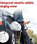 Heavy Duty EV Charger Plug Port Cover Featuring Hella Tough Weatherproof Polyester Build on charging port of electric vehicle.