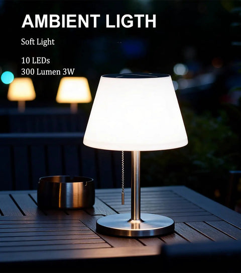 Solar Powered Outdoor Table Lamp With 3 Way Dimmable LED on patio table, lit, cordless with pull chain in outdoor setting