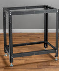 Beefy Drill Press Table And Miter Saw Stand Kit with heavy gauge steel frame, predrilled holes on wood flooring.