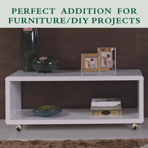 Four antique-brass swivel caster wheels installed on a white rectangular coffee table.