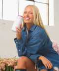 Keep It Frosty Insulated Stainless Steel Can Cooler For 12 Oz Slim Beverages Hella Cold Drink Holder, styled by woman in denim shirt.