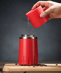 Kickstart Your Morning Anywhere With This Portable Manual Coffee Maker Equipped With Integrated Grinder And Bean Compartment Ideal For Camping Runs And Highway Hauls Pull Smooth Rich Brews Straight To Mug Effortless, red coffee maker pouring water.