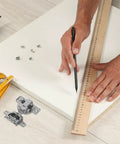 Concealed Cabinet Door Hinges Two Pack With Soft Close Buffer For Inward Opening Cabinets next to ruler and screws on white surface.