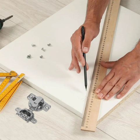 Concealed Cabinet Door Hinges Two Pack With Soft Close Buffer For Inward Opening Cabinets next to ruler and screws on white surface.